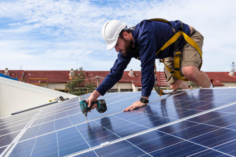 Solar panels being assessed during a UK installation